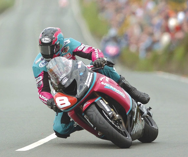 Ian Hutchinson rides the Superstock Kawasaki at the Isle of Man TT